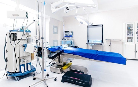 medical room with stretcher and machines