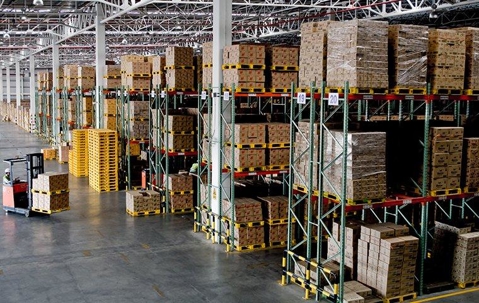 Warehouse with boxes pilled three-stories high